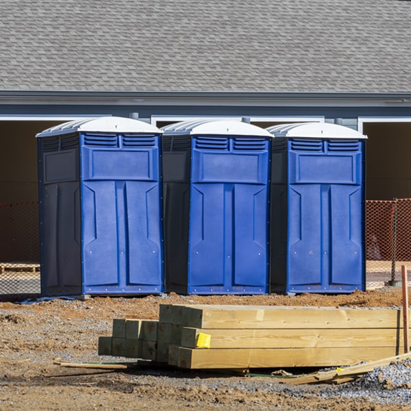 what is the cost difference between standard and deluxe portable restroom rentals in Amherst Center Massachusetts